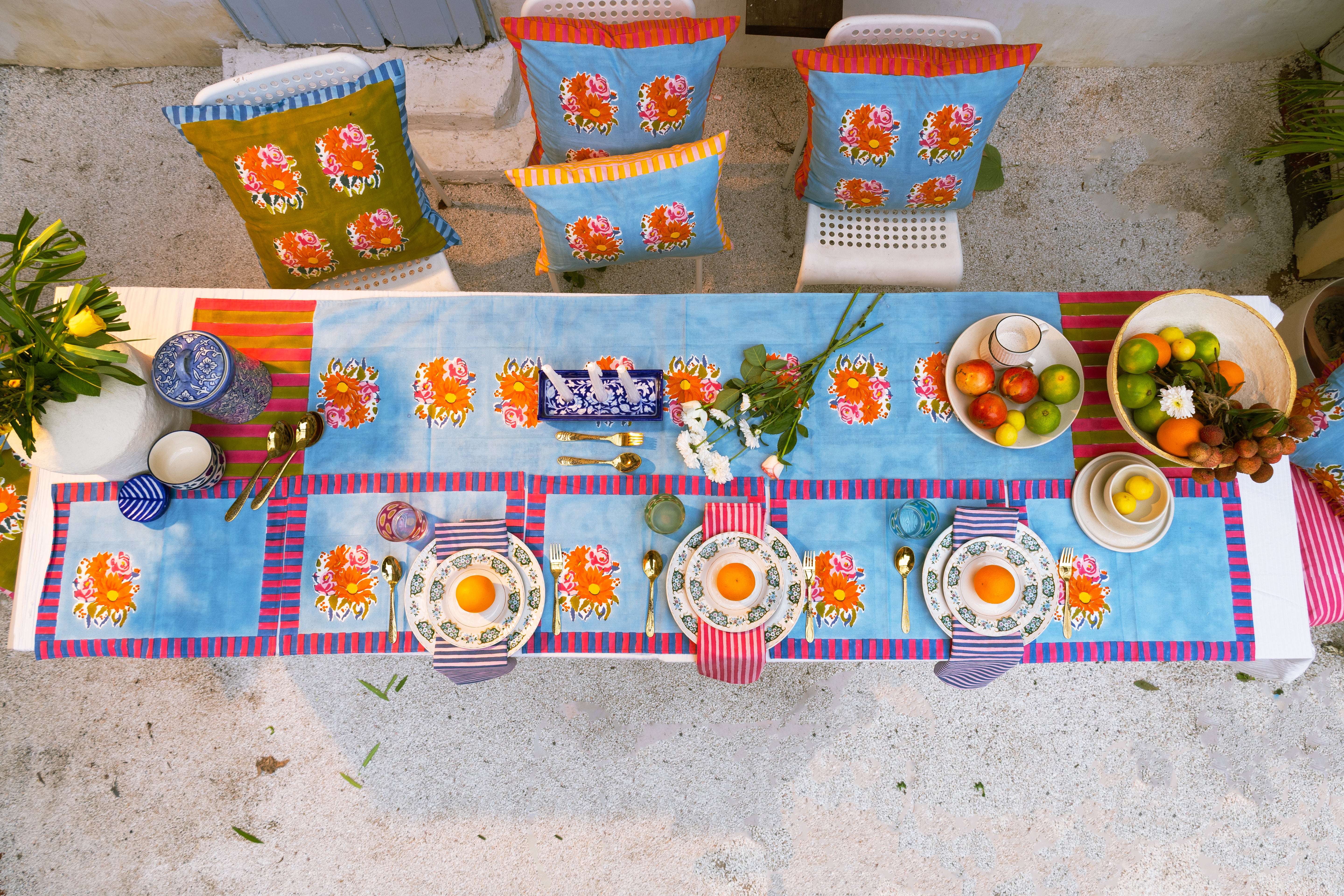 Decorative blue cotton placemats with a soft blue ground and striped geometric borders, designed for an authentic, modern home table setting.