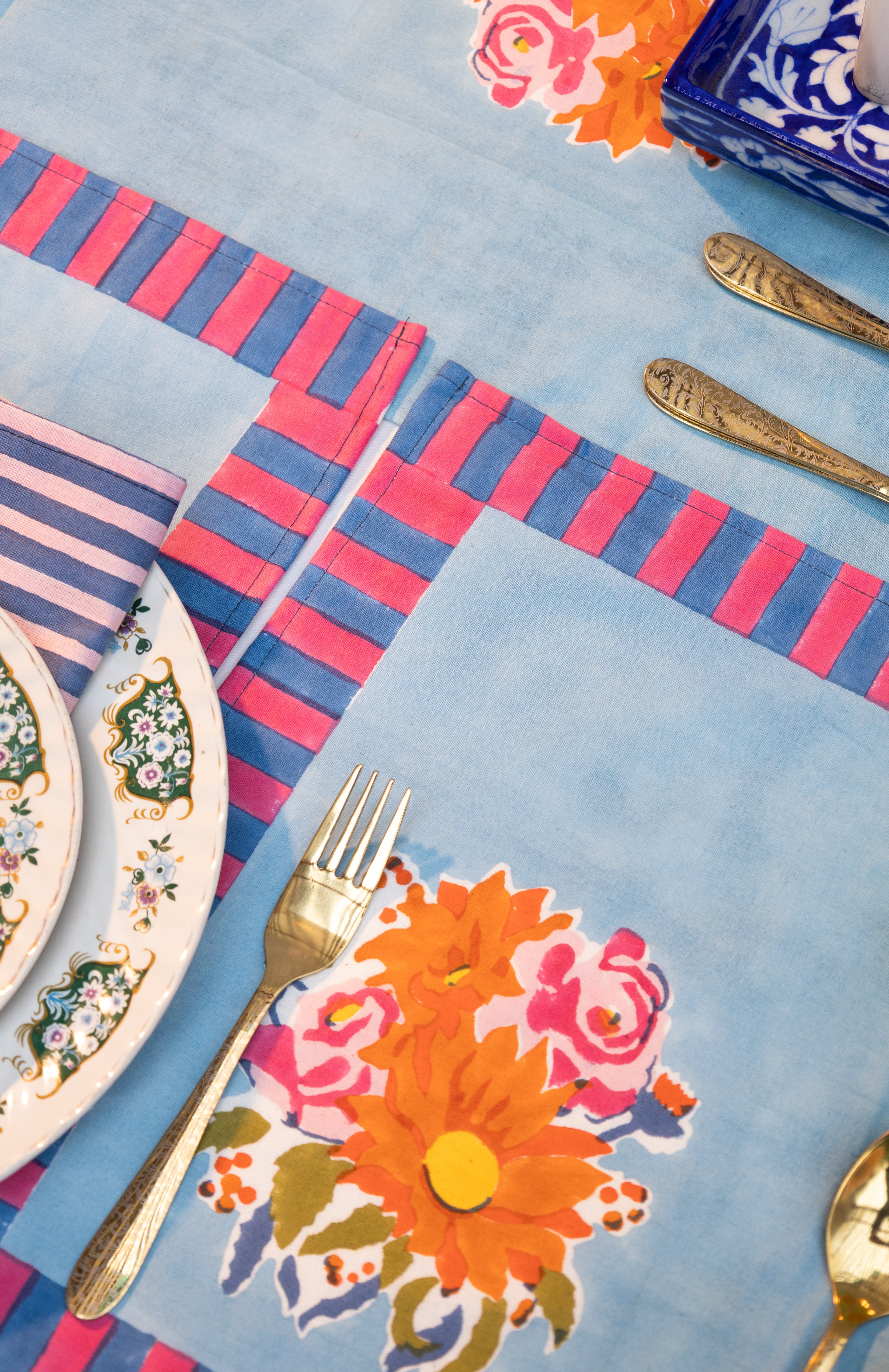 Artisan-made blue cotton placemats crafted from pure cotton and Azo-free dyes, reflecting a commitment to responsible production and small batches.