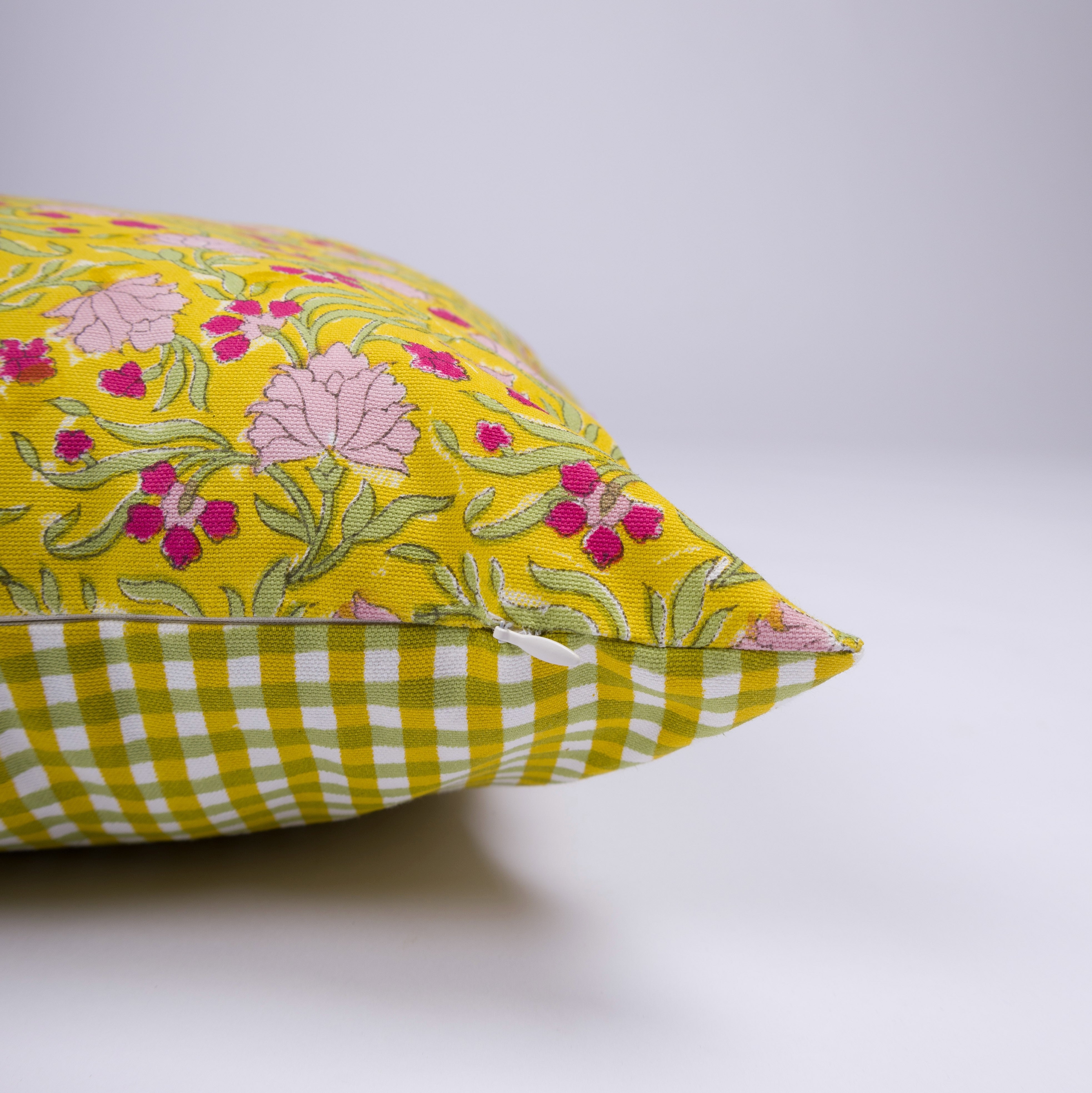 Artisan-made yellow floral throw pillow handcrafted by master printers in Rajasthan, India.