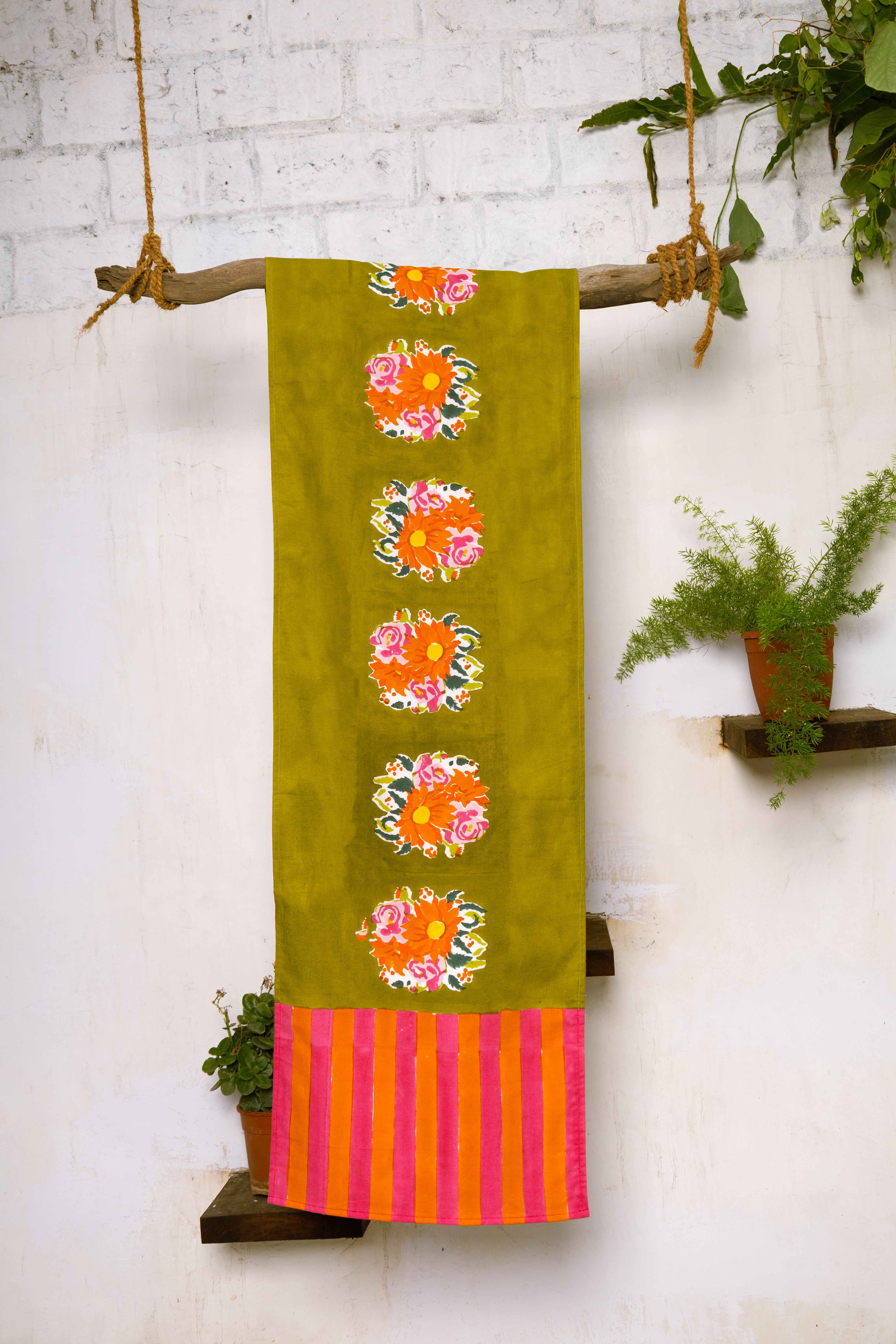Artisan-made green floral table runner crafted from pure cotton and Azo-free dyes, reflecting Thar's commitment to responsible production.
