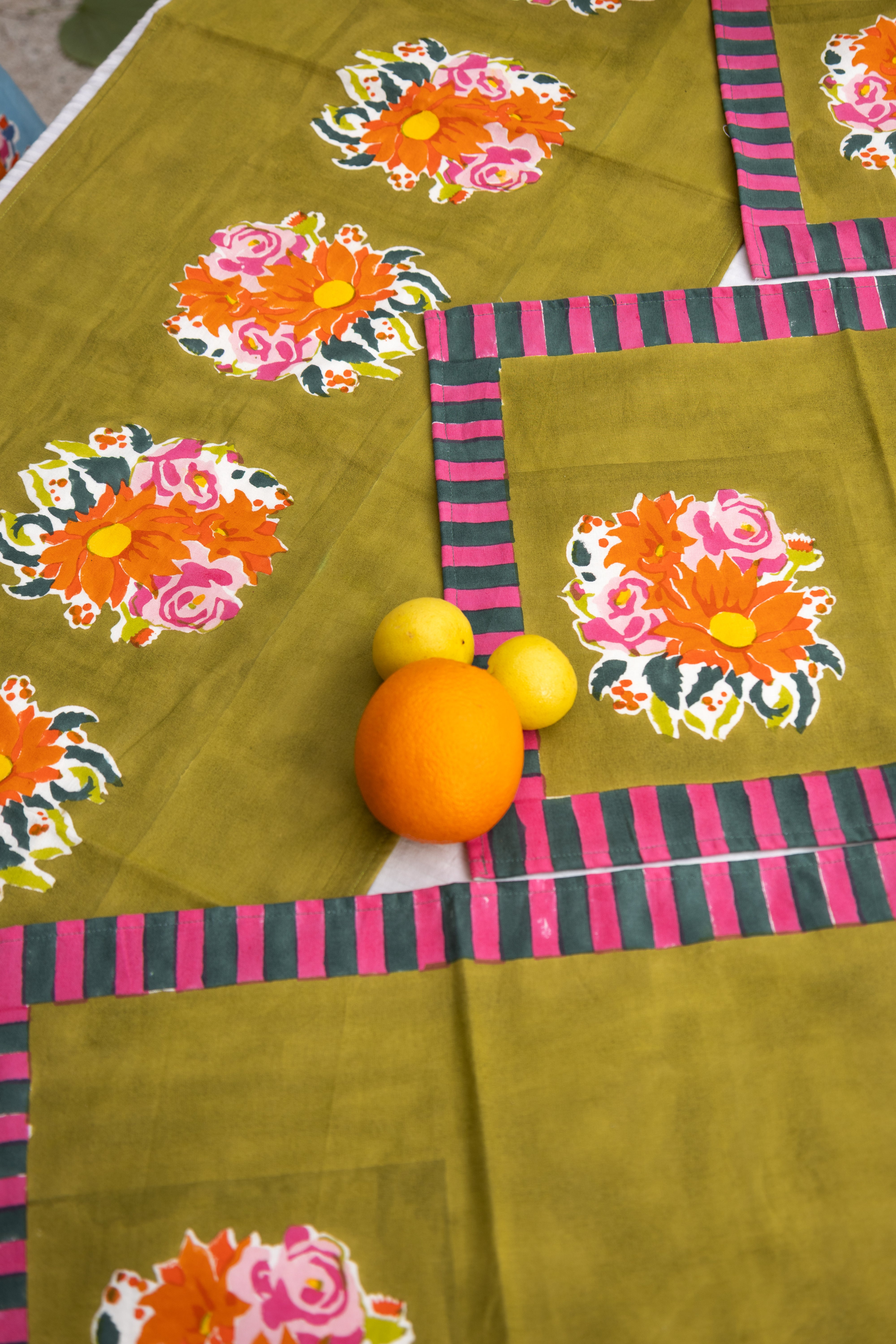 Green floral cotton table runner by Thar, designed for long lunches and sunlight-filled tables with a layered botanical aesthetic.