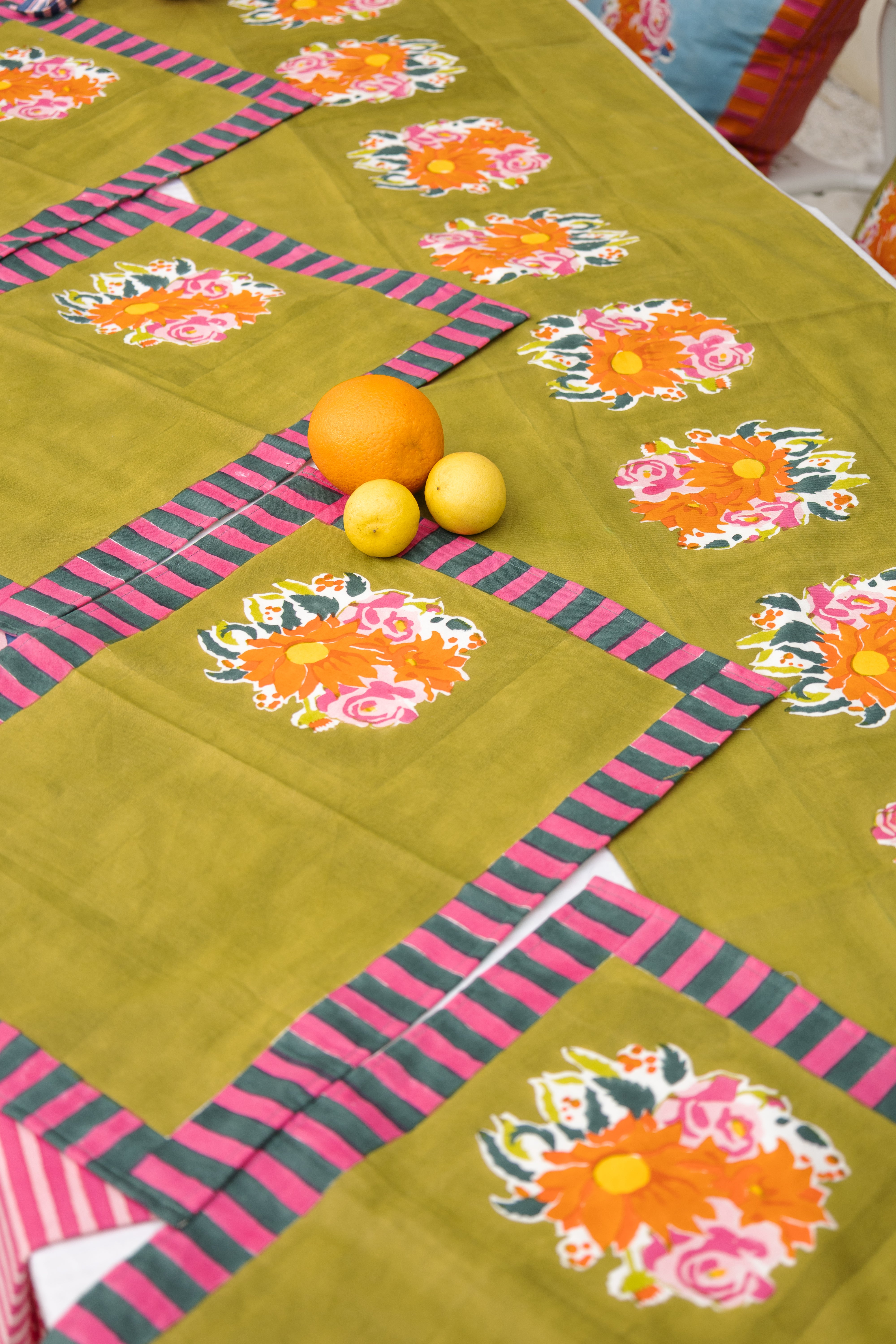 Consciously handcrafted green floral table runner, ethically produced in small batches by women-led artisan ventures.