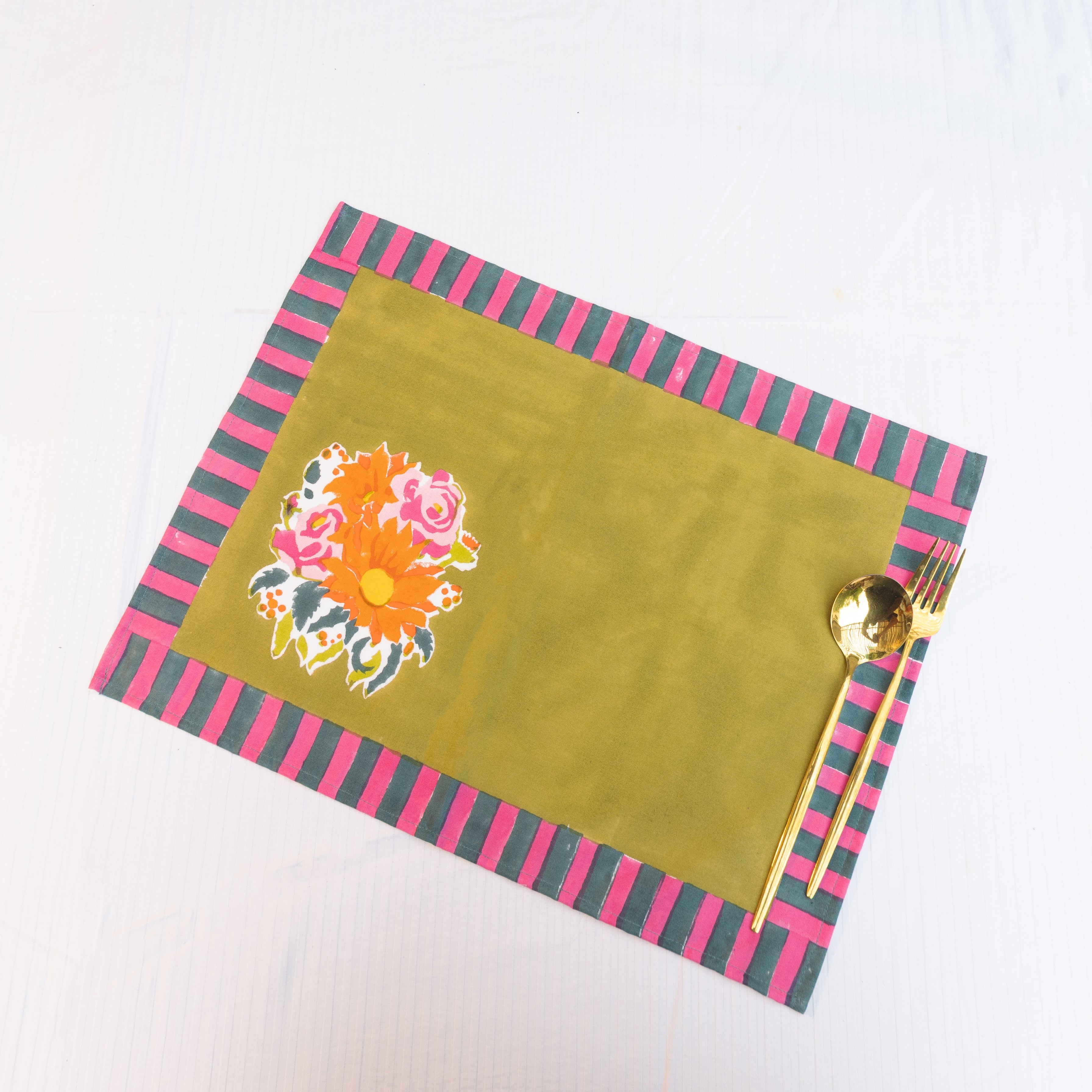 Gul green hand block-printed cotton placemats (set of 4) by Thar, featuring vibrant floral blossoms handcrafted by artisan communities.