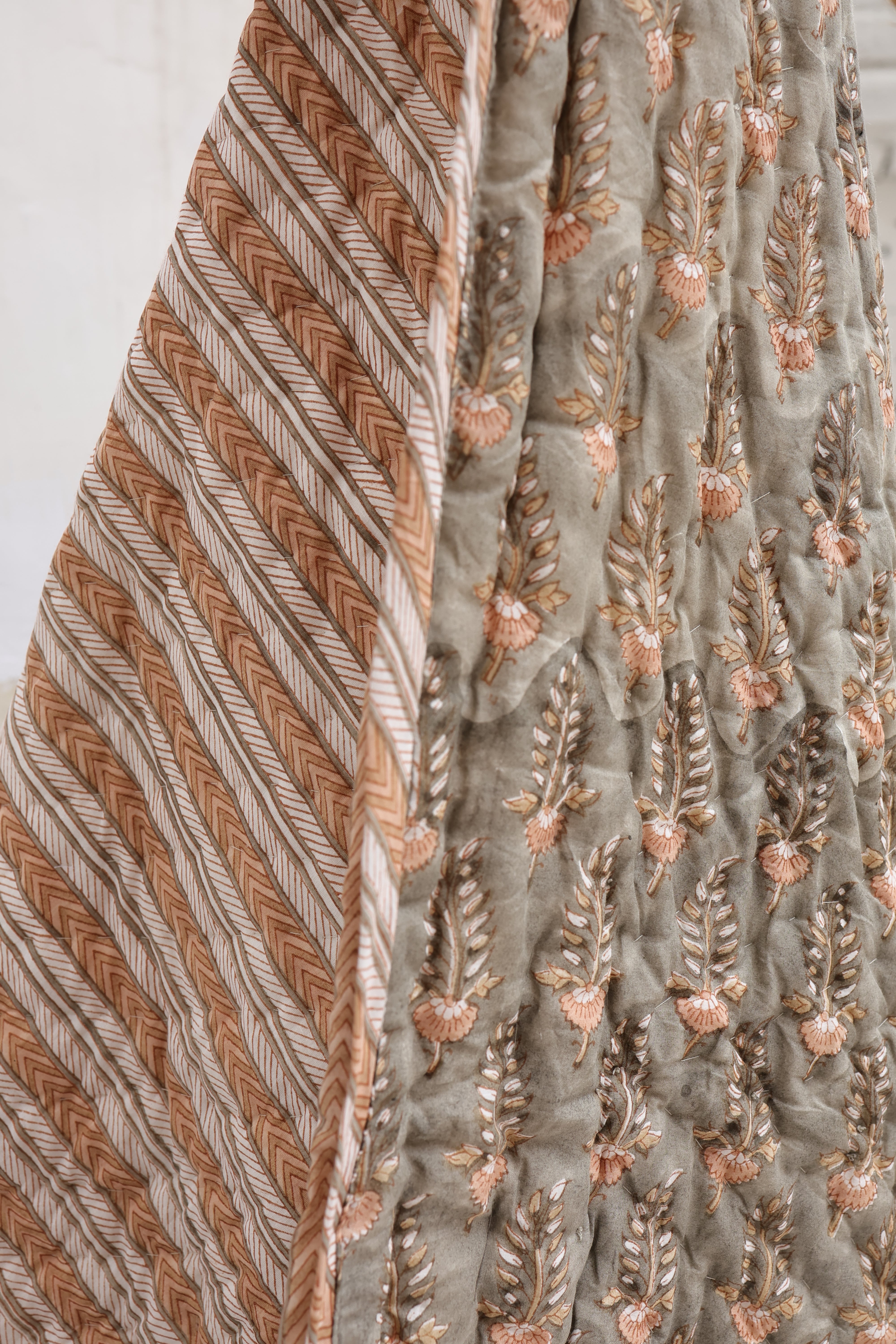 Hand-printed cotton muslin quilt designed to bring cultural storytelling and global handmade craftsmanship into modern spaces.