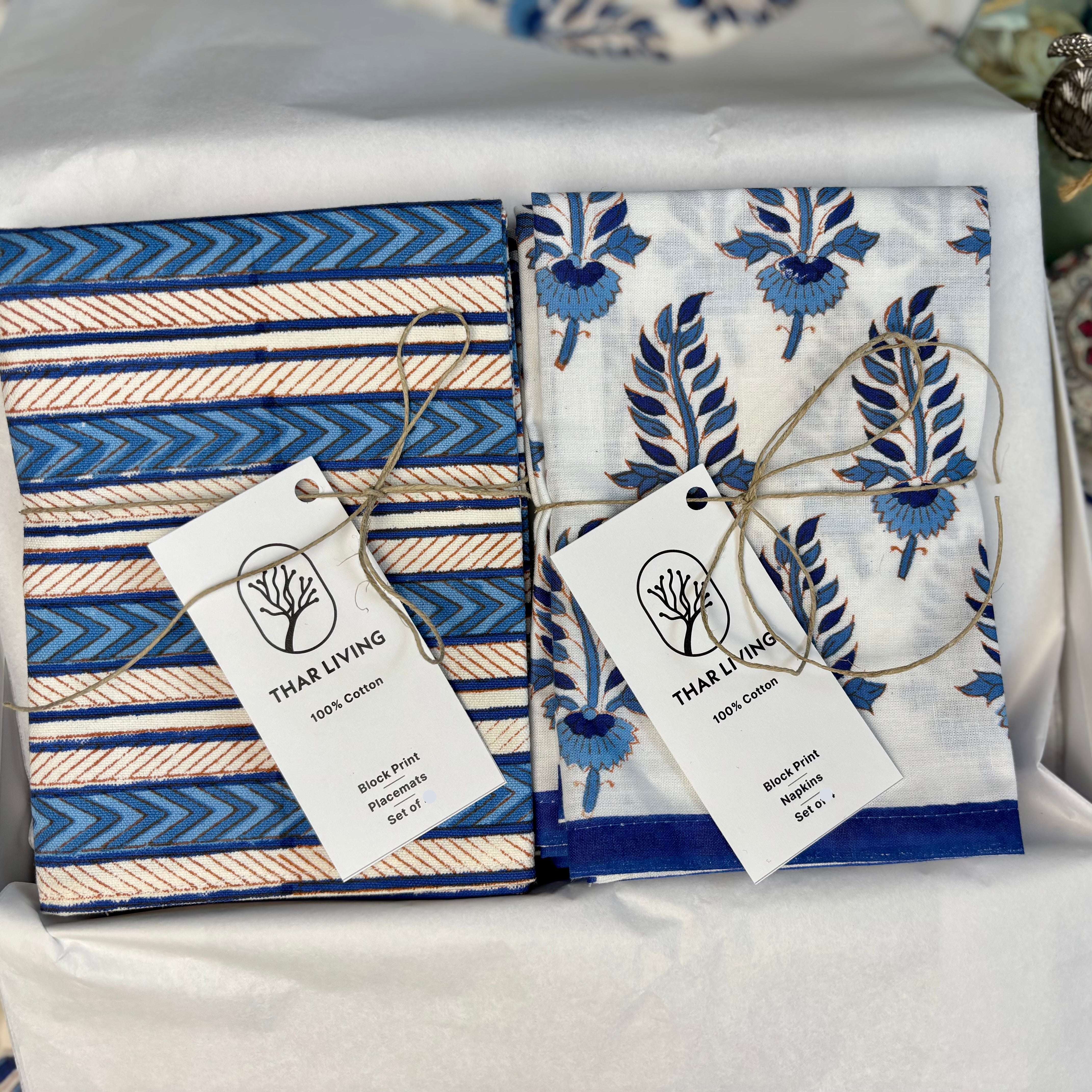 Noor Collection hand block-printed table linen gift set featuring 8 cotton mats and 8 napkins in shades of indigo and sky blue.