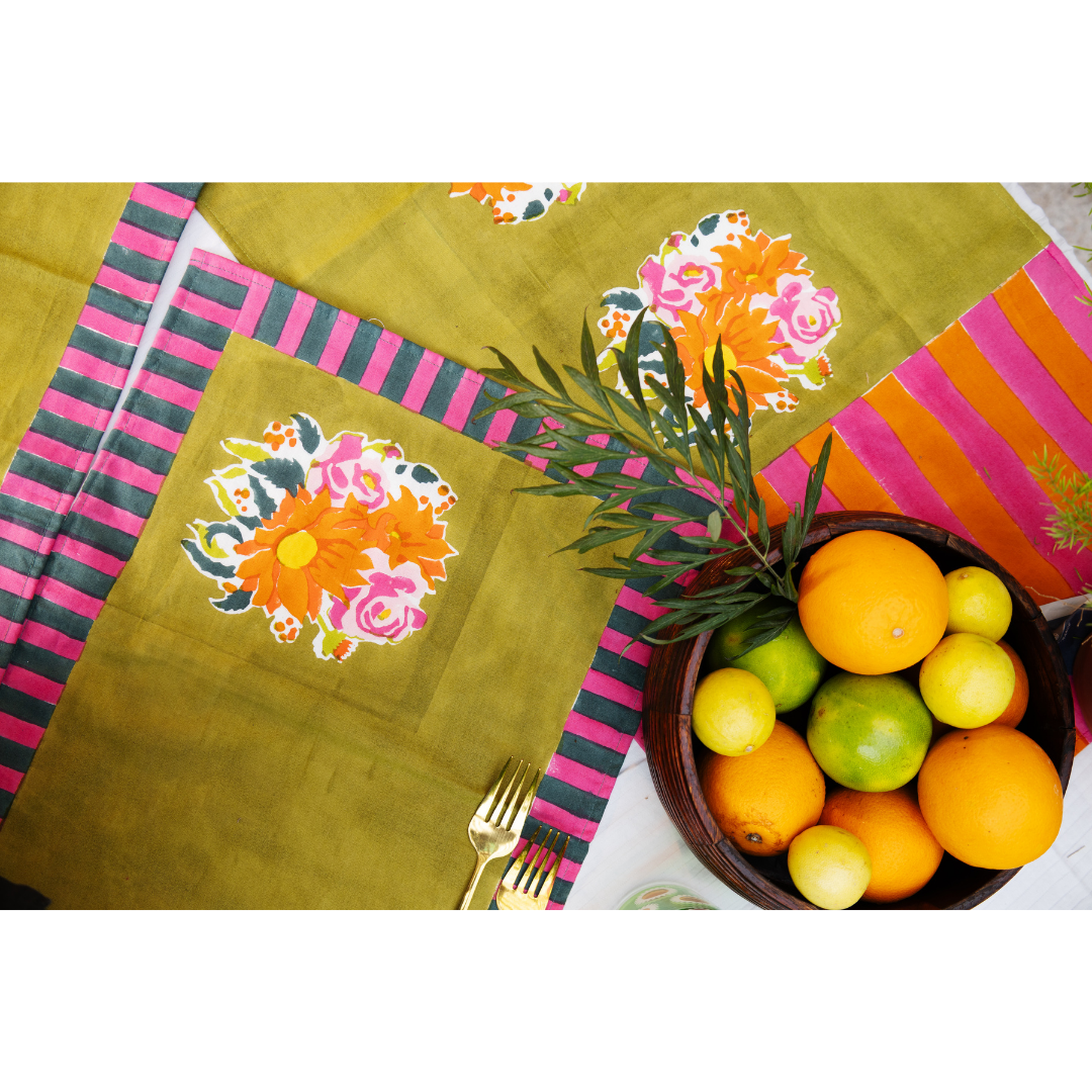 Consciously handcrafted green placemats ethically produced in small batches by women artisans to bring "soul and story" to modern homes.
