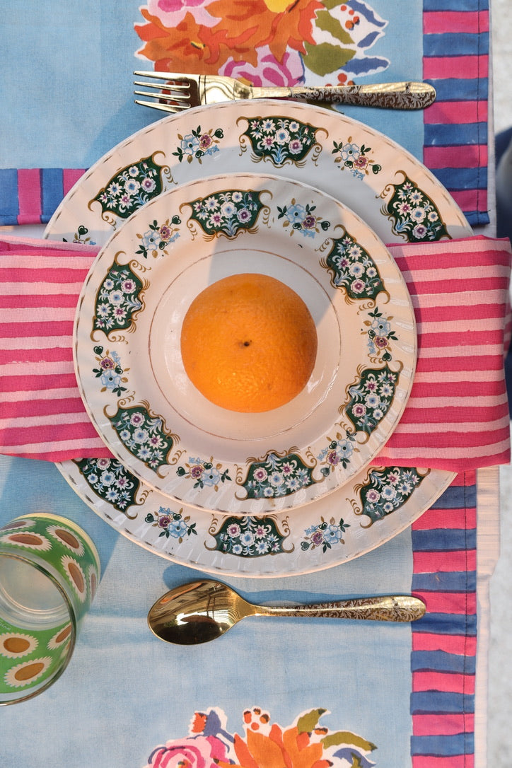 Artisan-made pink striped napkins crafted from pure cotton and Azo-free dyes, reflecting a commitment to responsible production