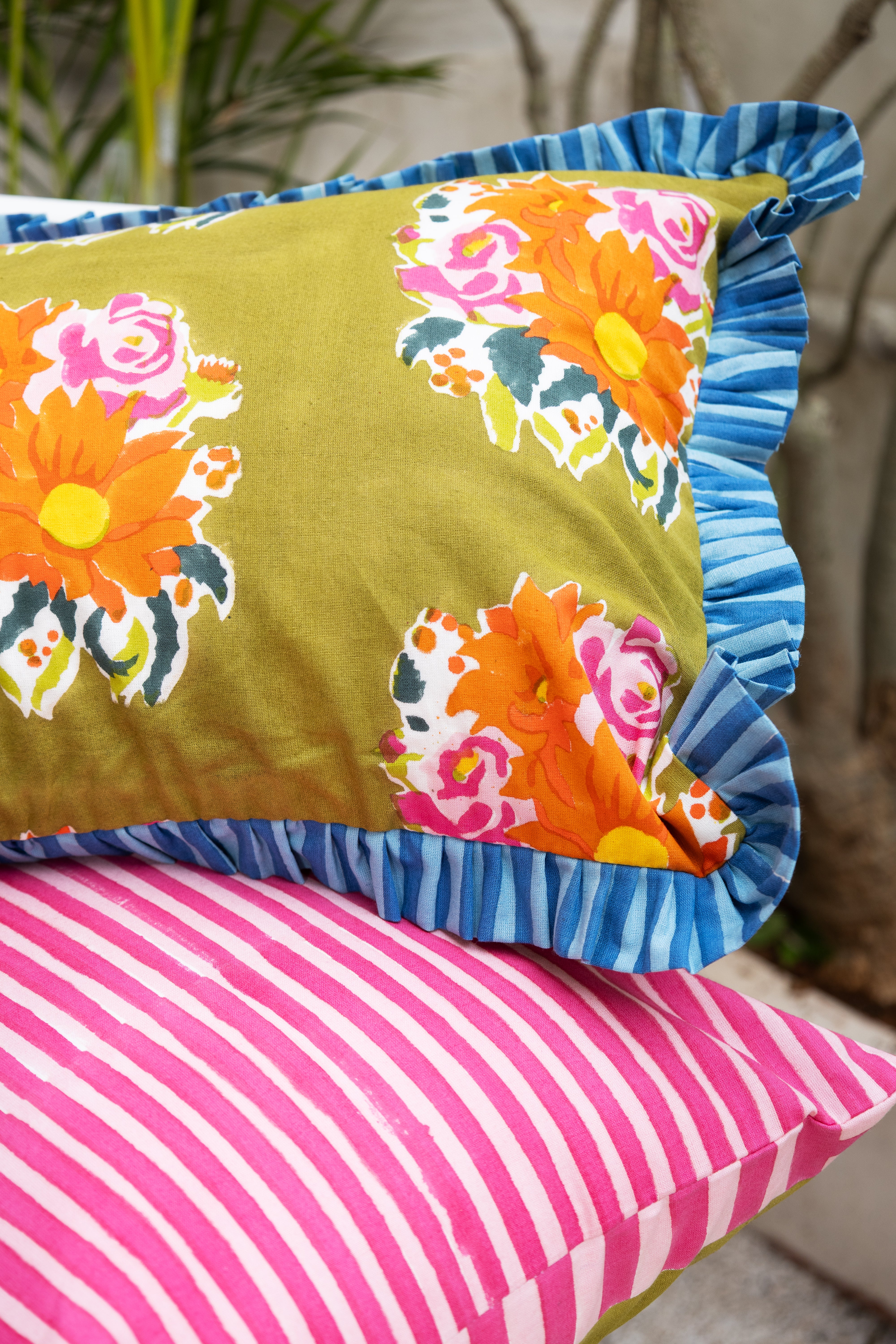 Consciously handcrafted green lumbar pillow cover, reflecting a commitment to traditional artistry and responsible production.