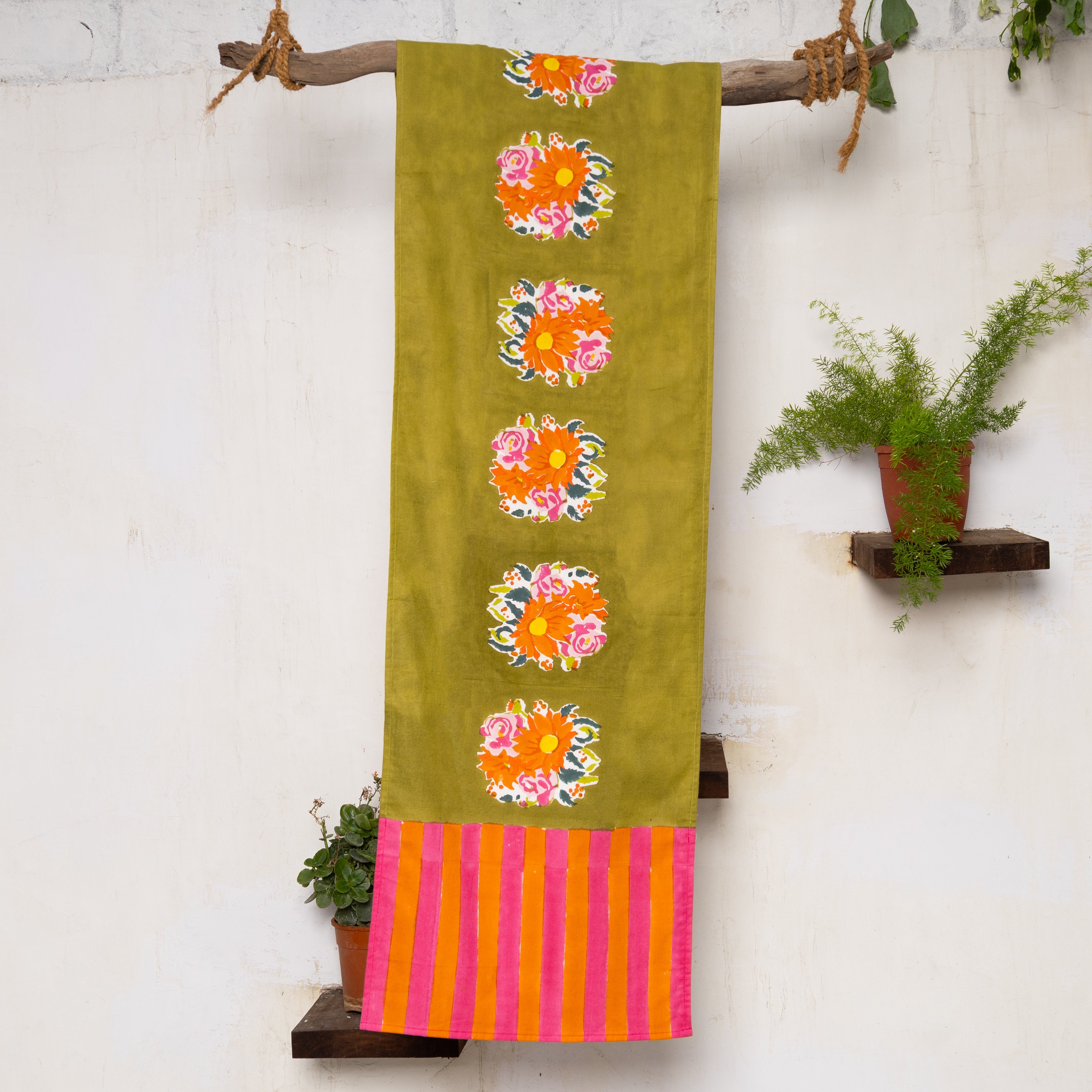 Gul green hand block-printed cotton table runner by Thar, featuring authentic floral clusters handcrafted by artisan communities.